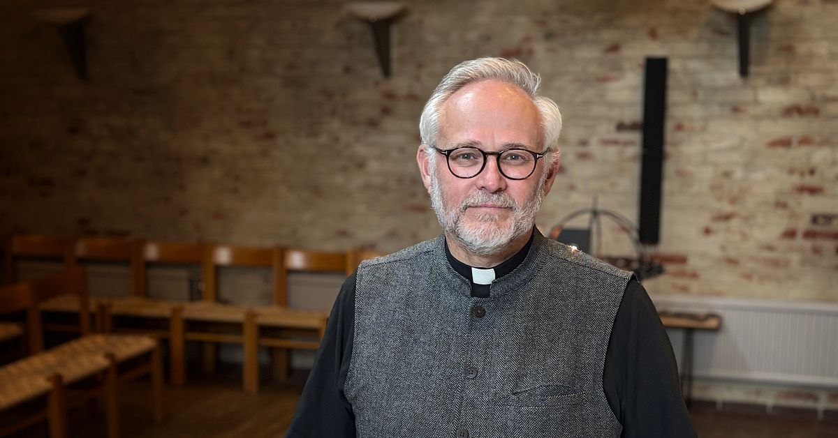Fr. JP Heath in a clerical collar inside the Seafarers’ Church in Malmö
